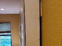 2022-03-21 08.49.53  Side view of dispenser.  I used square-drive pocket screws to hold the back panel in. You can see the French Cleat that holds the dispenser on to the wall by gravity. You can barely see the Cleat Shim that spaces the bottom of the dispenser away from the wall.